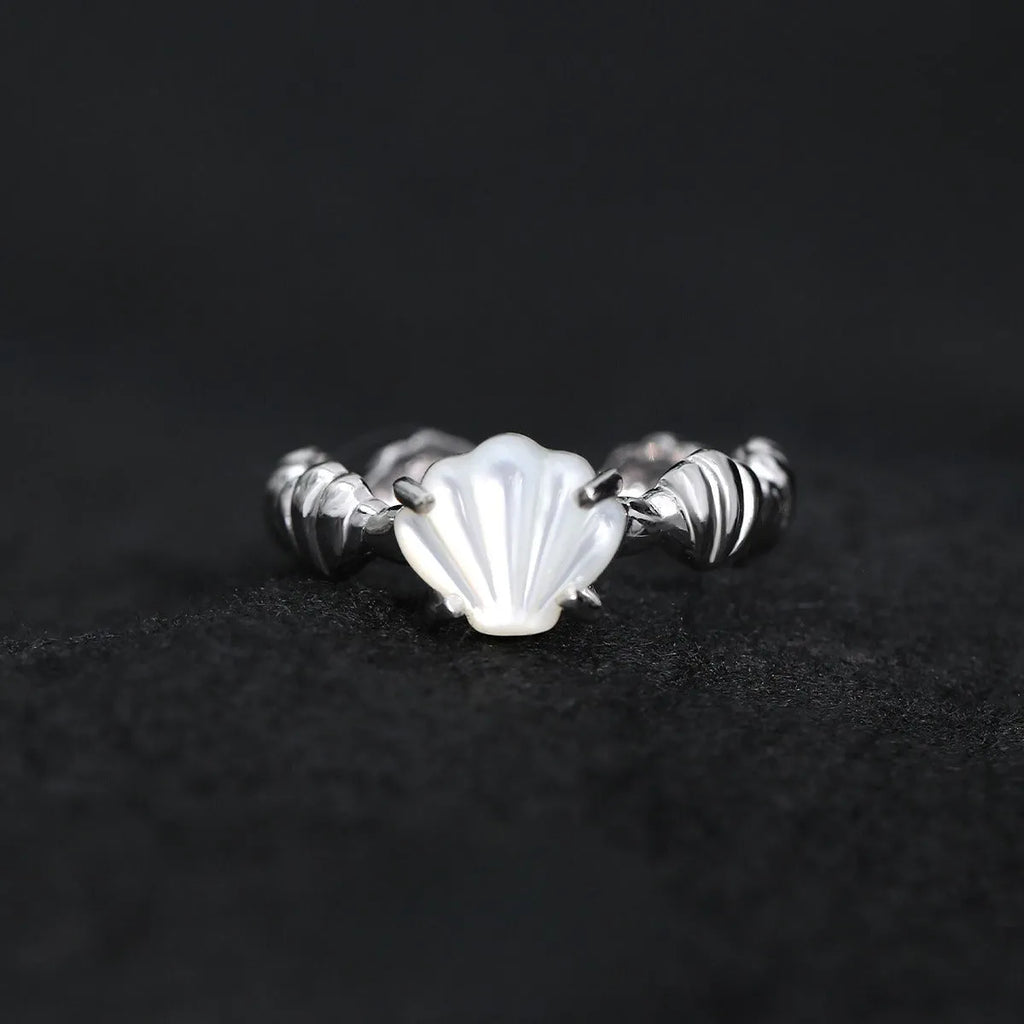Adjustable silver ring with shell decoration and tiger eye stone on adjustable band