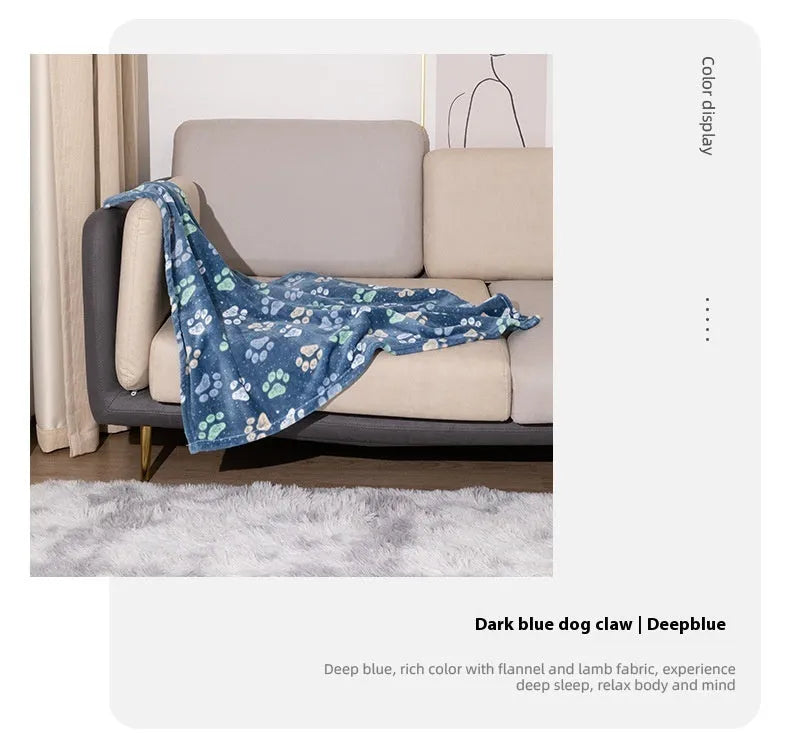 Blue cartoon dog print double-sided flannel pet blanket laid flat.