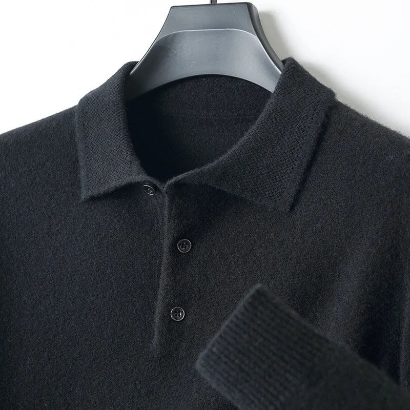 Men's woollen polo collar pullover sweater in a neutral colour showing long sleeves and textured collage stitching.