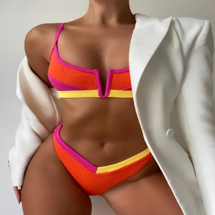 Women's high waist triangle split swimsuit set in multiple colours, showing top and shorts.