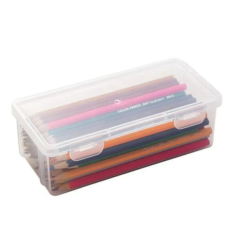 Transparent plastic pencil storage box showing interior capacity for organising drawing supplies