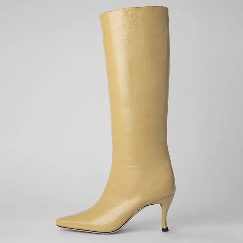 Women's square toe ankle cowboy boots in various colours on a neutral background.