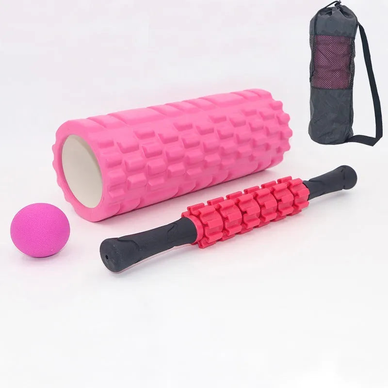 Black foam fitness roller with six-piece gear design, 33cm length, for massage and recovery.