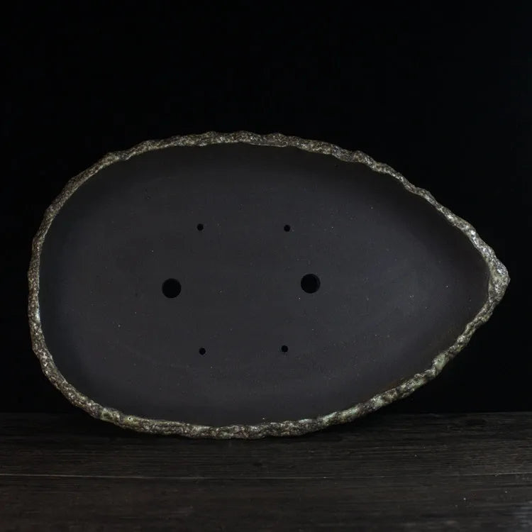 Handmade purple clay flower pot showing traditional craftsmanship and floor-standing design