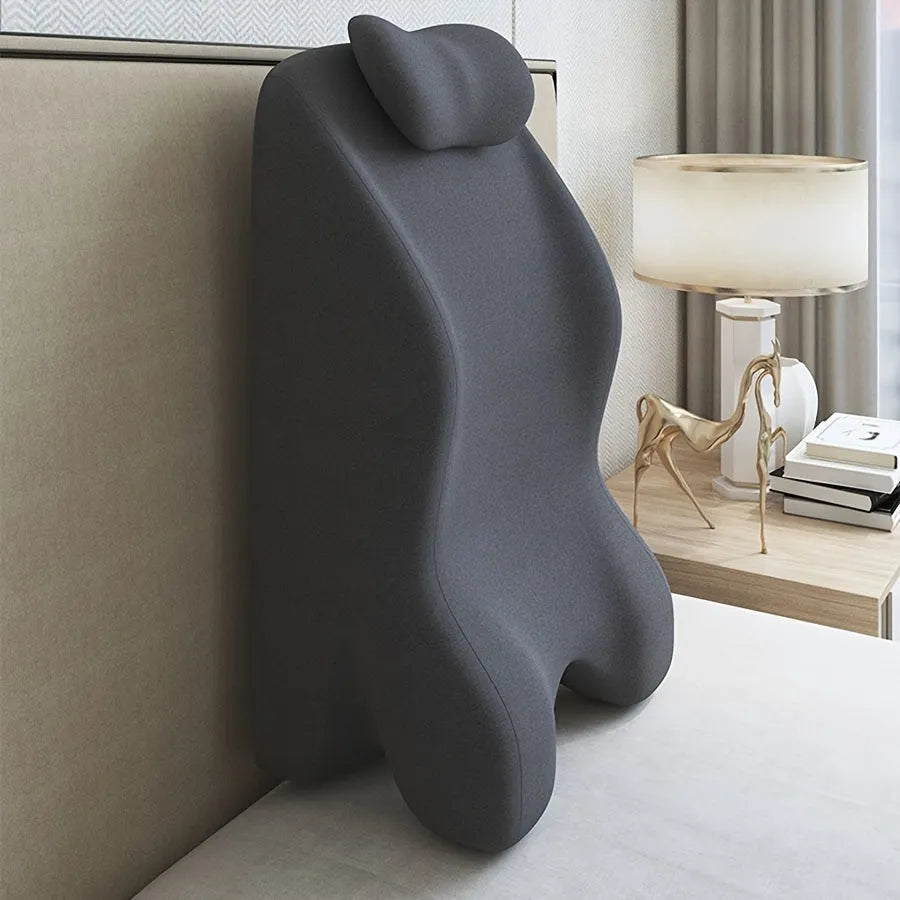 Stomach sleeper pillow with a centre hole, shown in blue, dark grey, green, and light grey colour options.