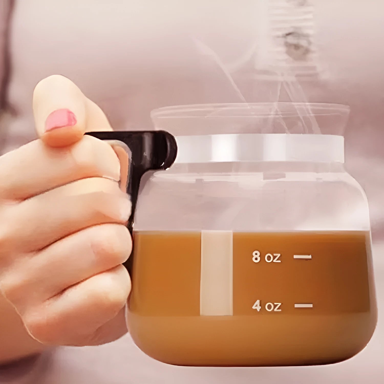 Transparent borosilicate glass coffee maker with silicone cover showing modern simple style