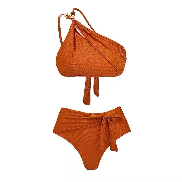 Brown high waisted push up bikini with a sheer split chiffon dress overlay on a mannequin.