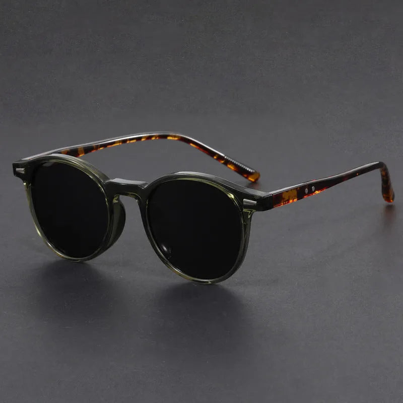 Retro round oval frame sunglasses with polarised grey lenses shown in multiple colour options.