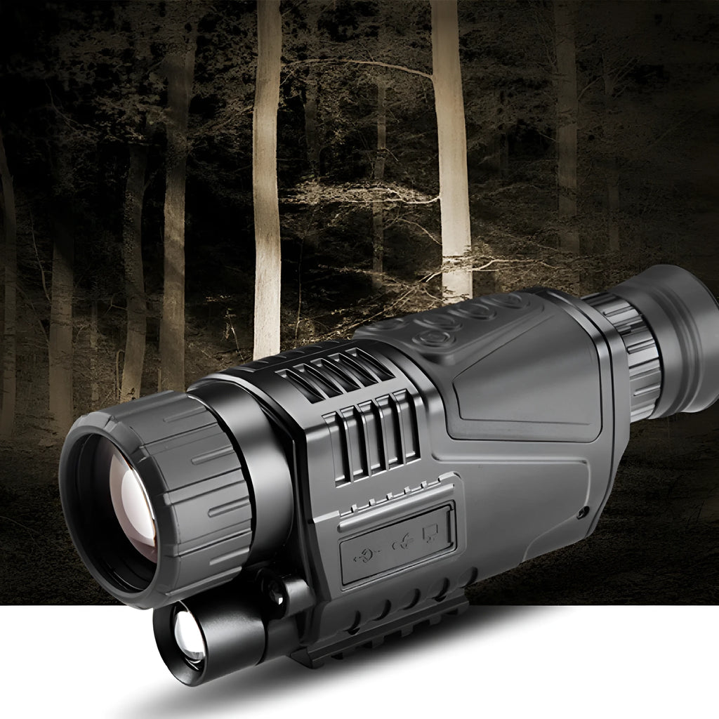 Black infrared digital night vision telescope with camera lens, rubber grip, and wrist strap on a table.