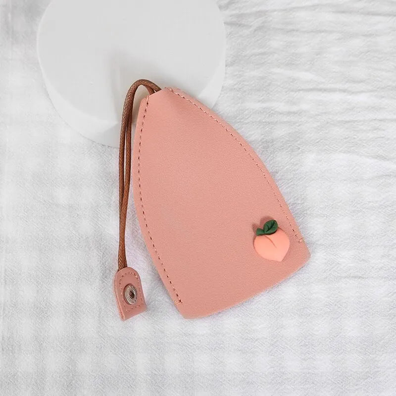 Cartoon PU leather pull-out car key case measuring 14 x 7.5cm with colourful designs