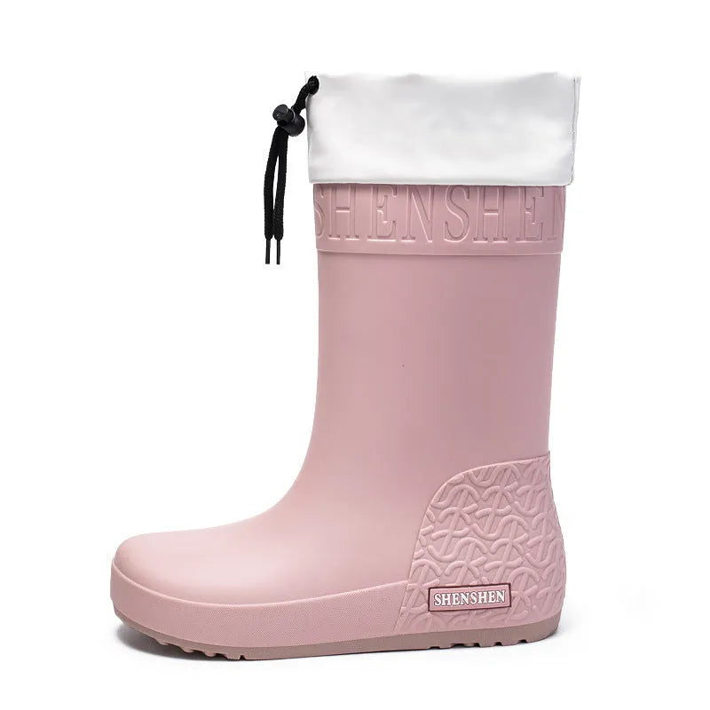 Women's solid colour PVC rain boots in apricot, black, brown, or pink.