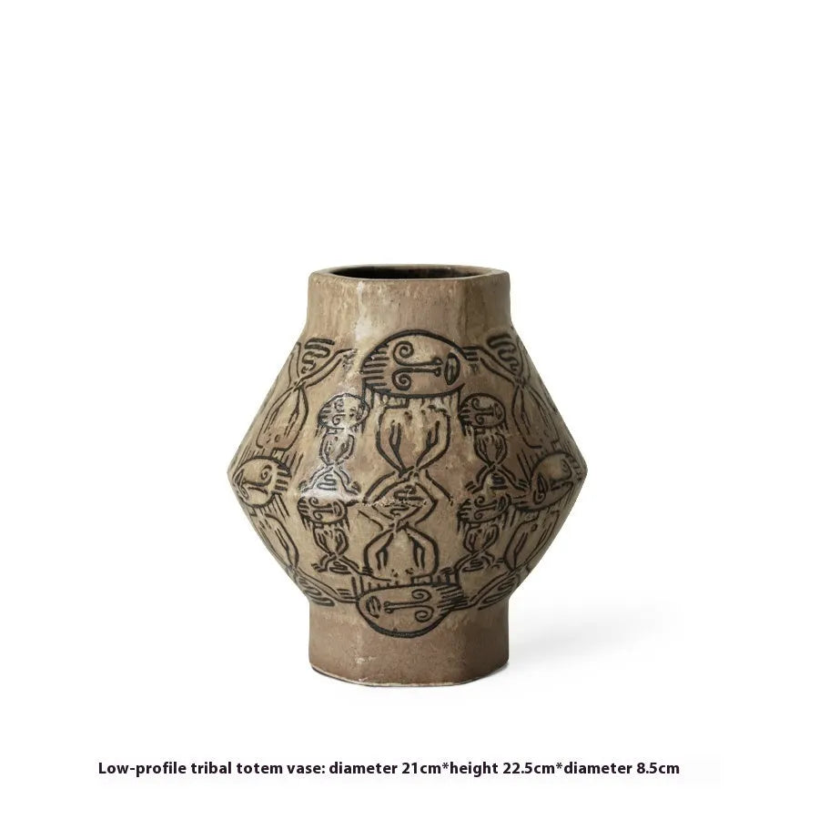 Hand-painted ceramic vase with tribal totem patterns in cylindrical shape