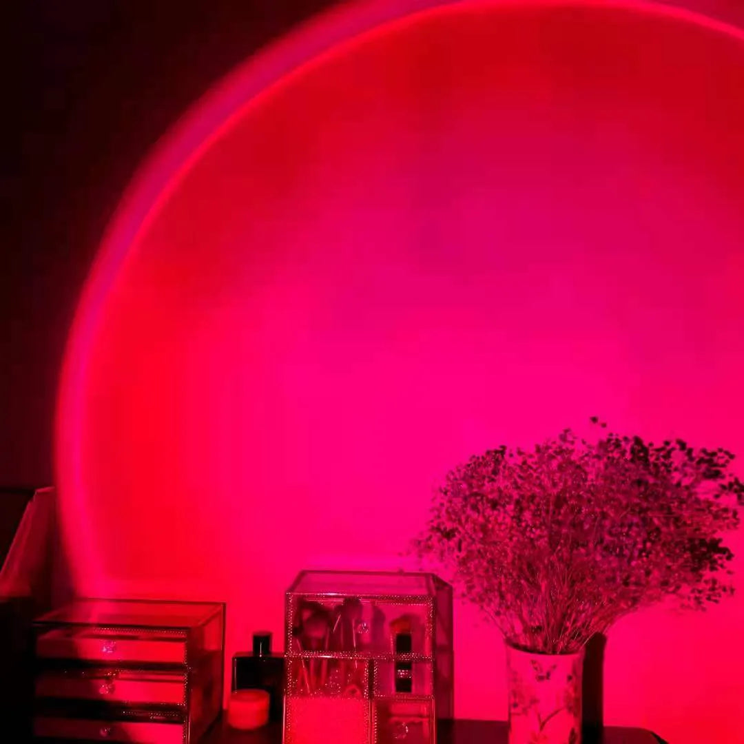 Rechargeable sunset projection lamp showing rainbow and red light patterns