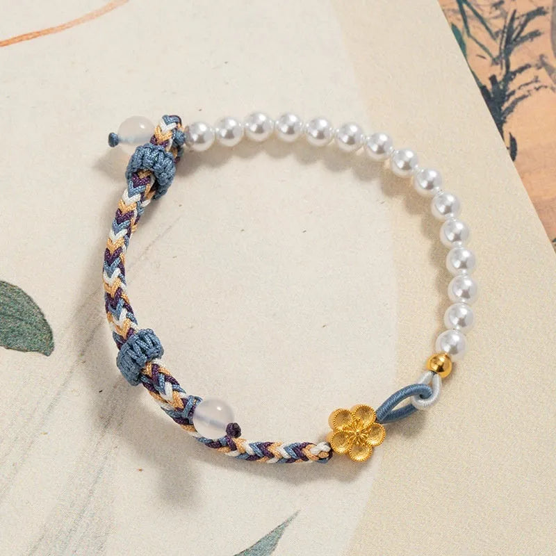 Peach coloured cord carrying strap with electroplated sterling silver chalcedony bead and Chinese flower weaving design