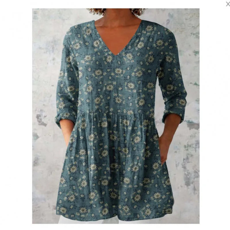 Women's loose-fitting printed dress with 3/4 sleeves and a wide waist design.
