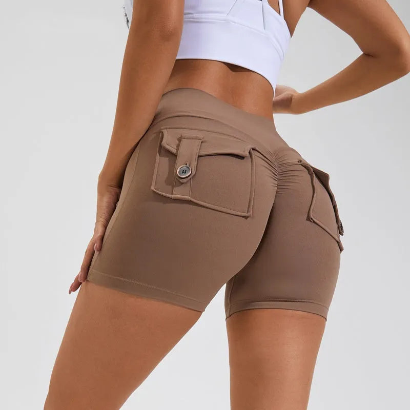 Women's high-waist fitness shorts in quick-dry nylon with side pockets, shown in Electric Blue.
