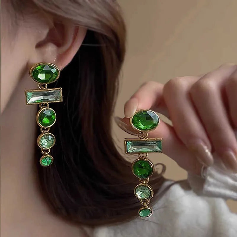 Retro green geometric earrings with dangling tassels and zircon detailing on alloy studs