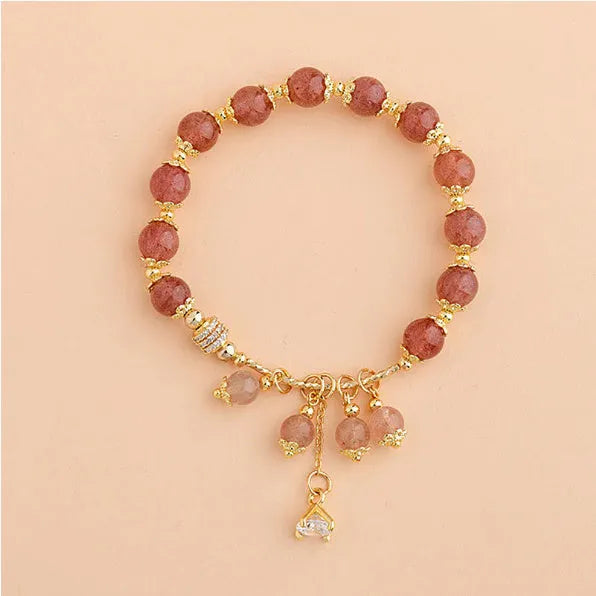 Pink women's bracelet with heart-shaped strawberry quartz crystal and pearl decorative elements