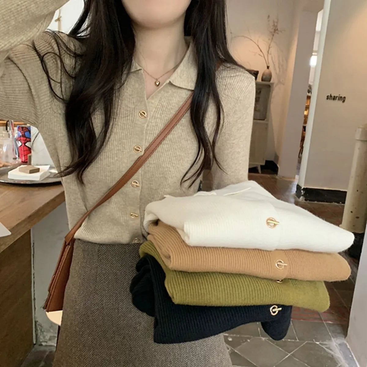 Women's beige loose-fit viscose knitted cardigan top with long sleeves shown worn open.