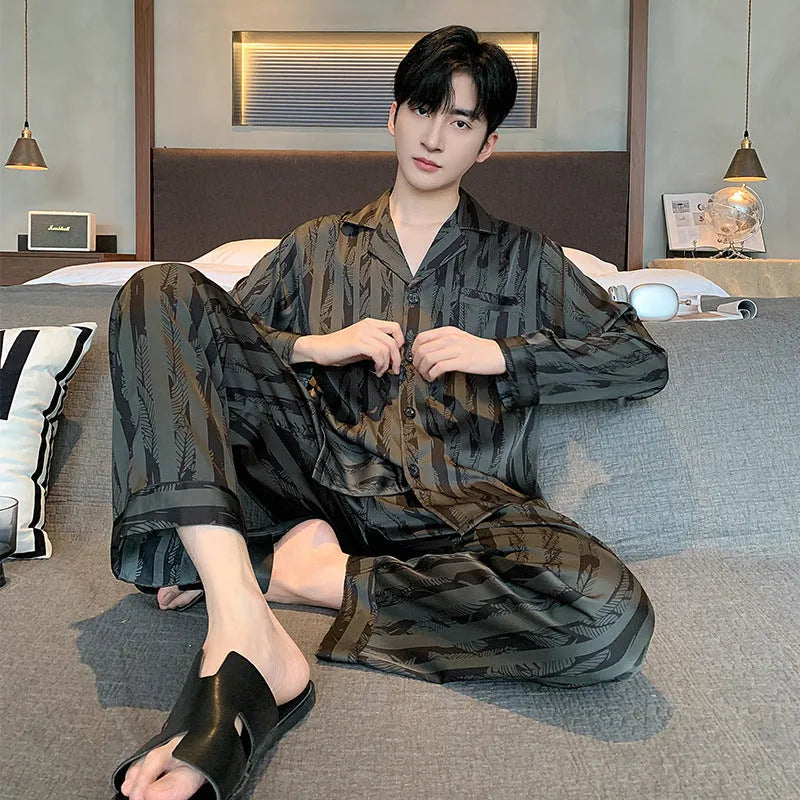 Men's black striped Ice Silk pajama set with long sleeves and trousers laid flat