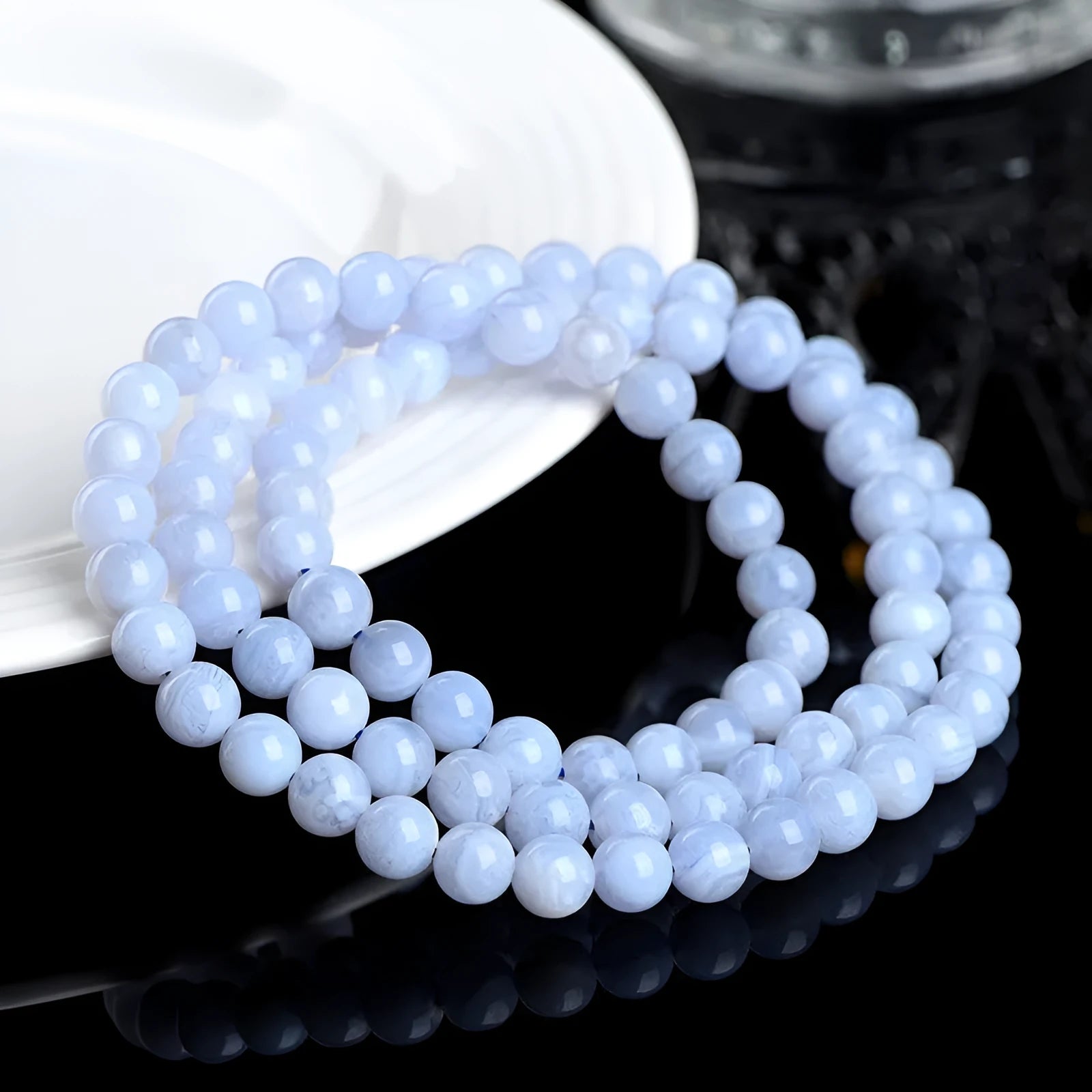 Close-up of a blue multi-circle patterned agate bead bracelet with 6-6.8mm beads and ruyi decorative elements.