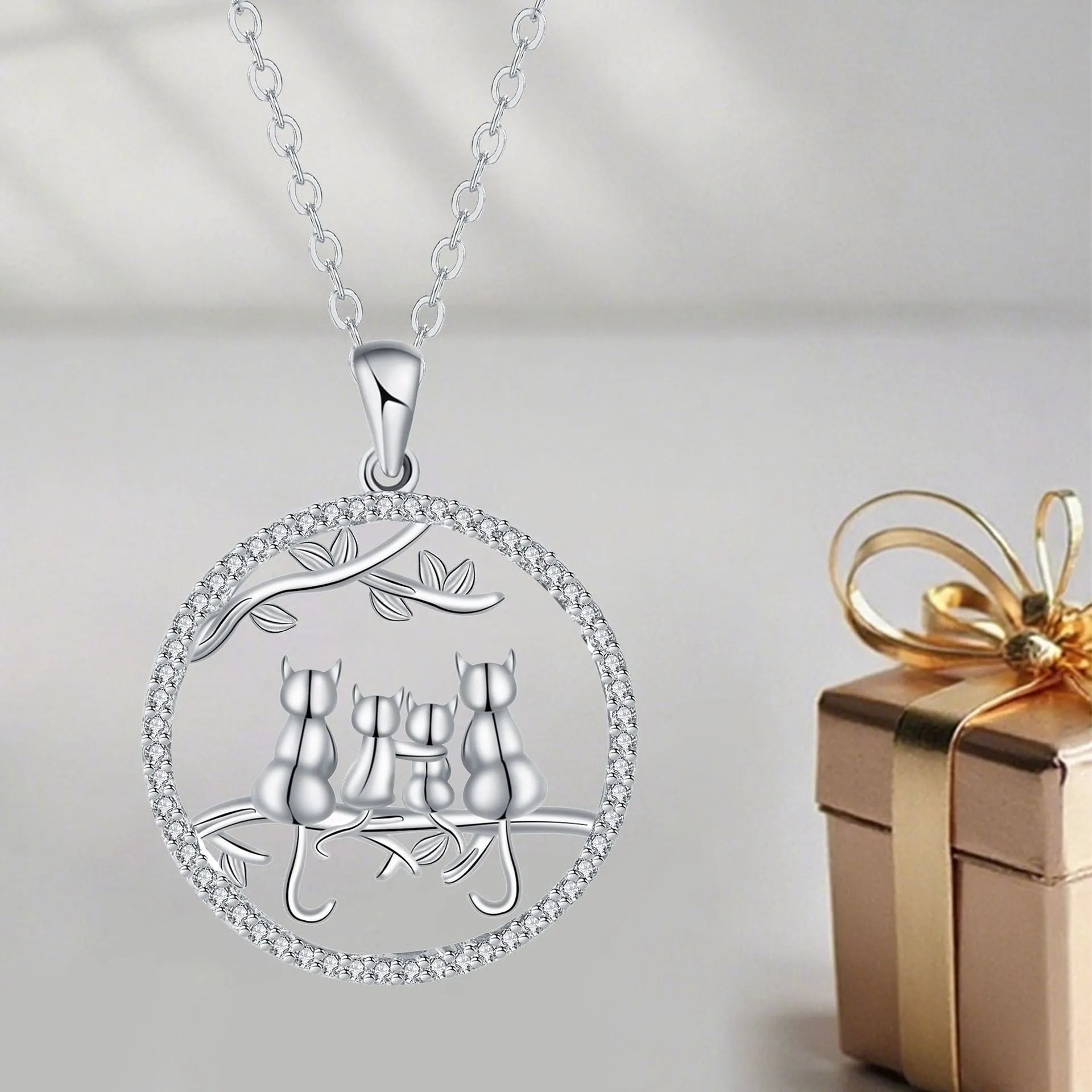 Copper necklace with four kitten pendant design and cross chain styling