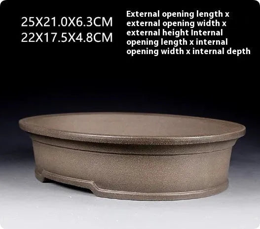 Handmade antique oval bonsai flower pot in purple sand clay, showing dimensions.