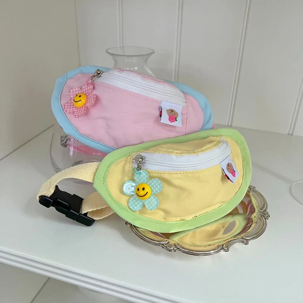 Powder blue backpack-style carrier for a small dog, showing adjustable straps and soft-sided construction.