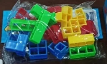 Plastic balance stacking board game with colourful blocks, chassis, and base on table