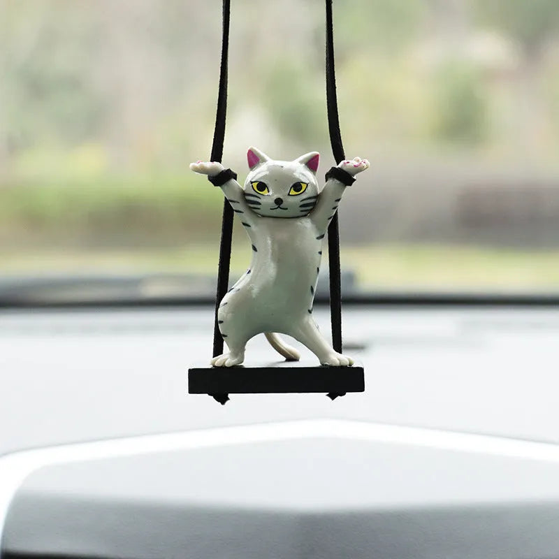 Cartoon-style resin cat pendant car ornament with adjustable rope in colour options including black, white, floral, grey, and brown.