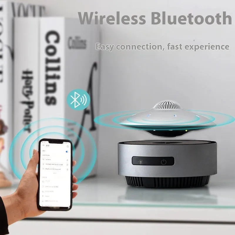 Automatic lifting magnetic levitation Bluetooth speaker floating above charging base
