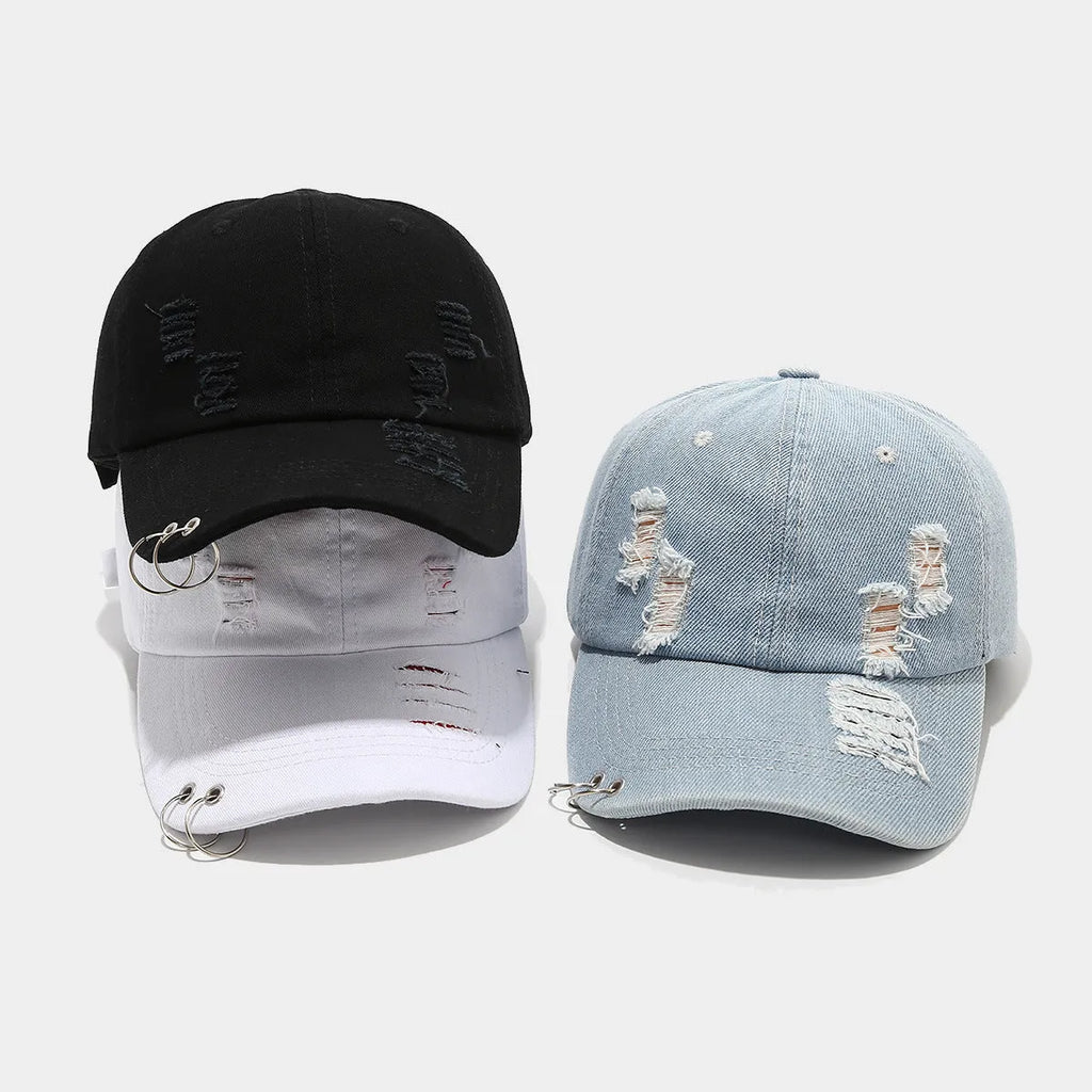 Men's adjustable denim peaked cap in black, shown from a side angle.