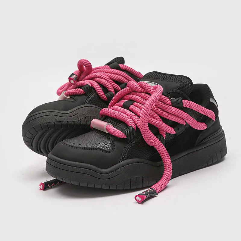 Low-top lace-up casual sneakers in denim blue with a round toe and thick rubber sole.