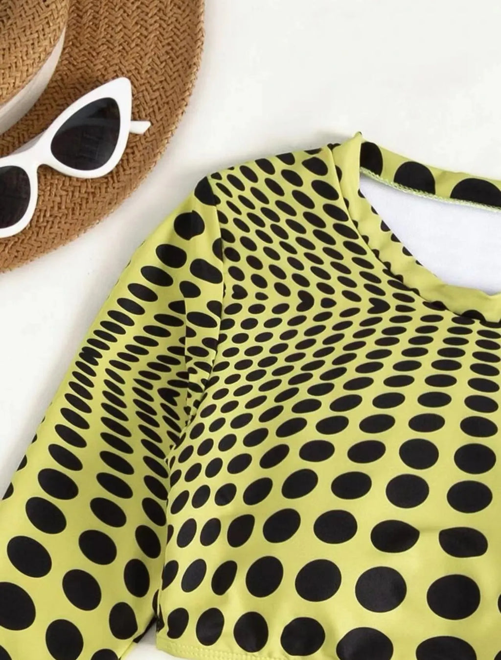 Women's green and yellow polka dot three-piece swimsuit set with top, skirt, and bra.