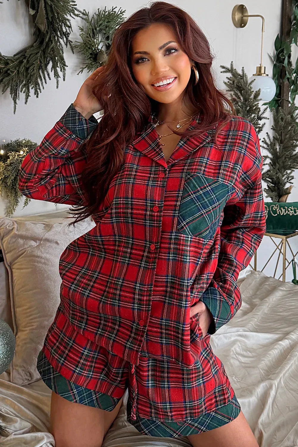 Red plaid Christmas pajama set with long sleeve shirt and shorts on hanger