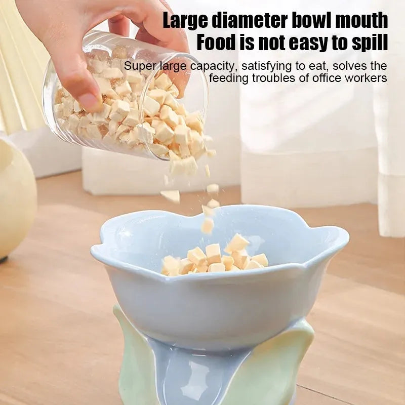 Blue ceramic raised pet bowl with floral pattern and non-slip base for cats and small dogs