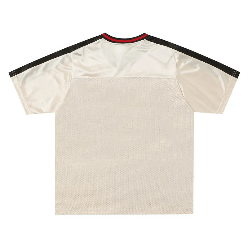 Apricot couple tops with letter print design showing loose fit and drop-shoulder sleeves