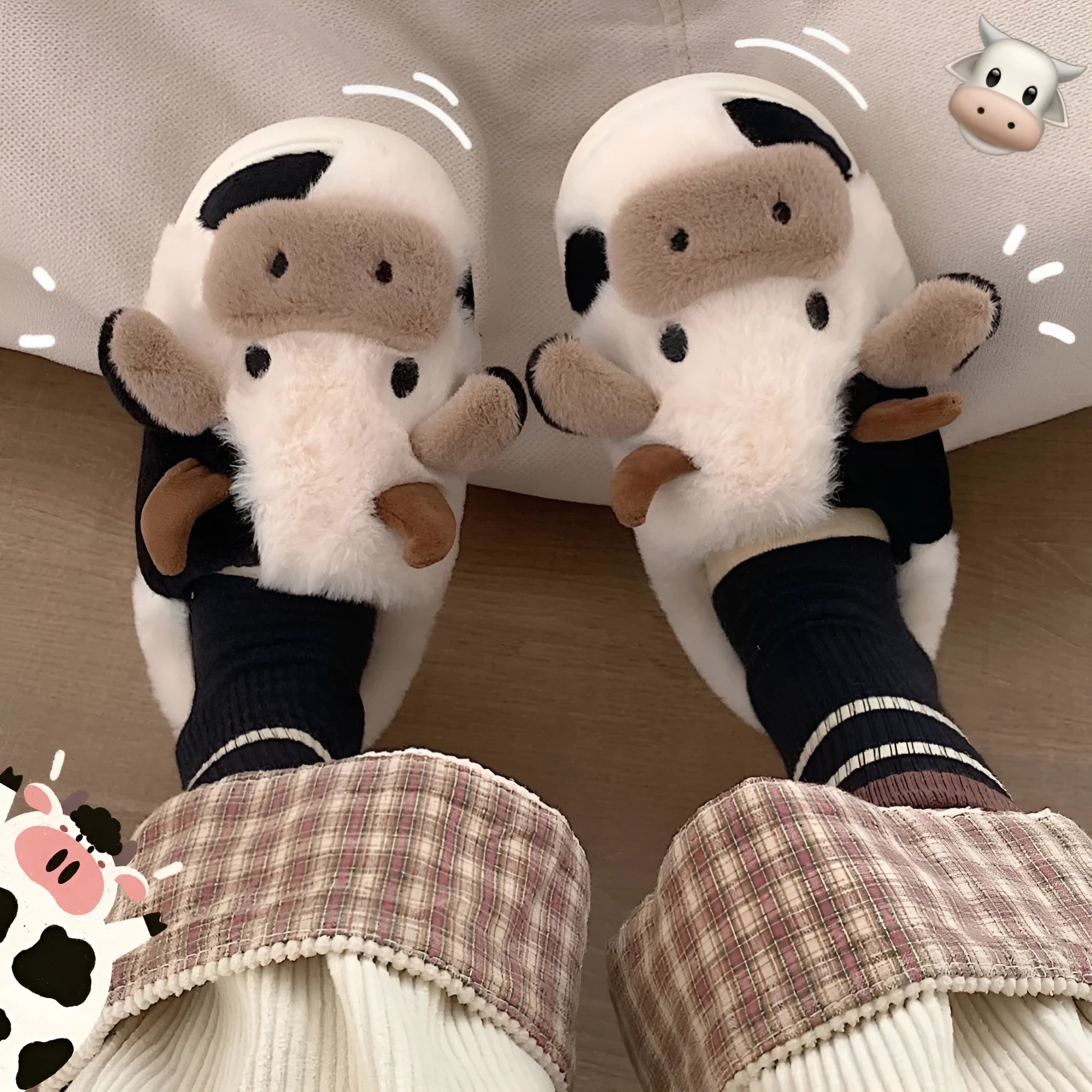 White cartoon cow plush slippers for women with a non-slip textured sole.