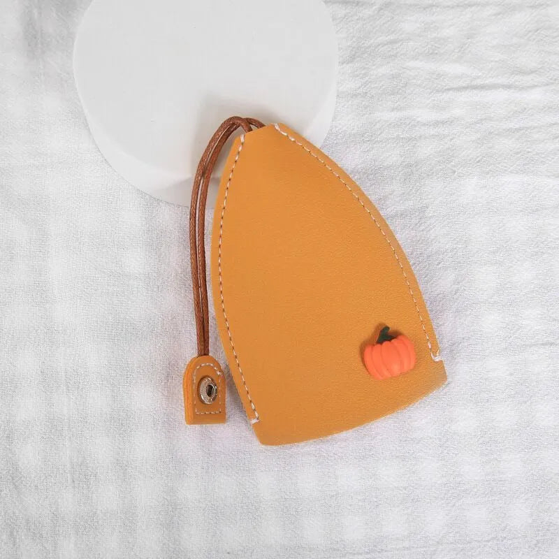 Cartoon PU leather pull-out car key case measuring 14 x 7.5cm with colourful designs