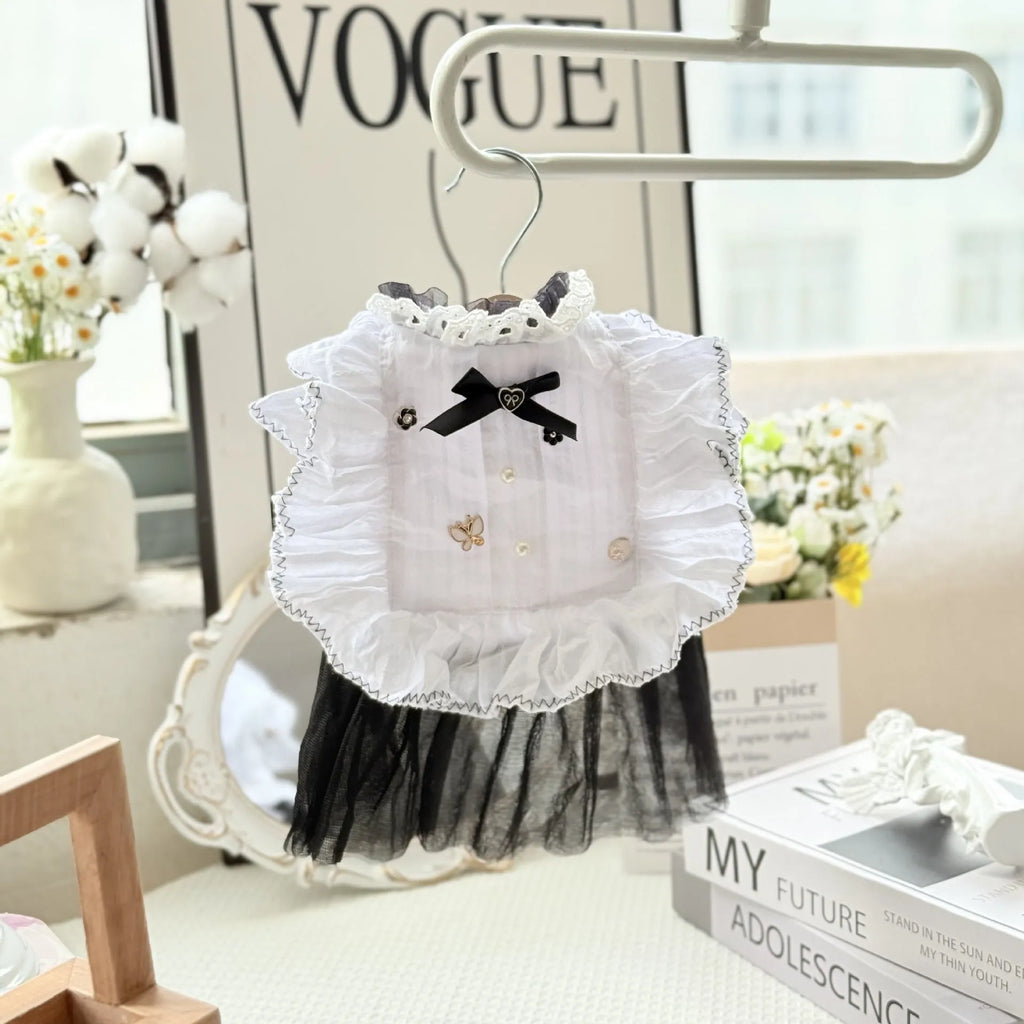 White polyester dog dress with a layered gauze skirt, shown on a small dog.