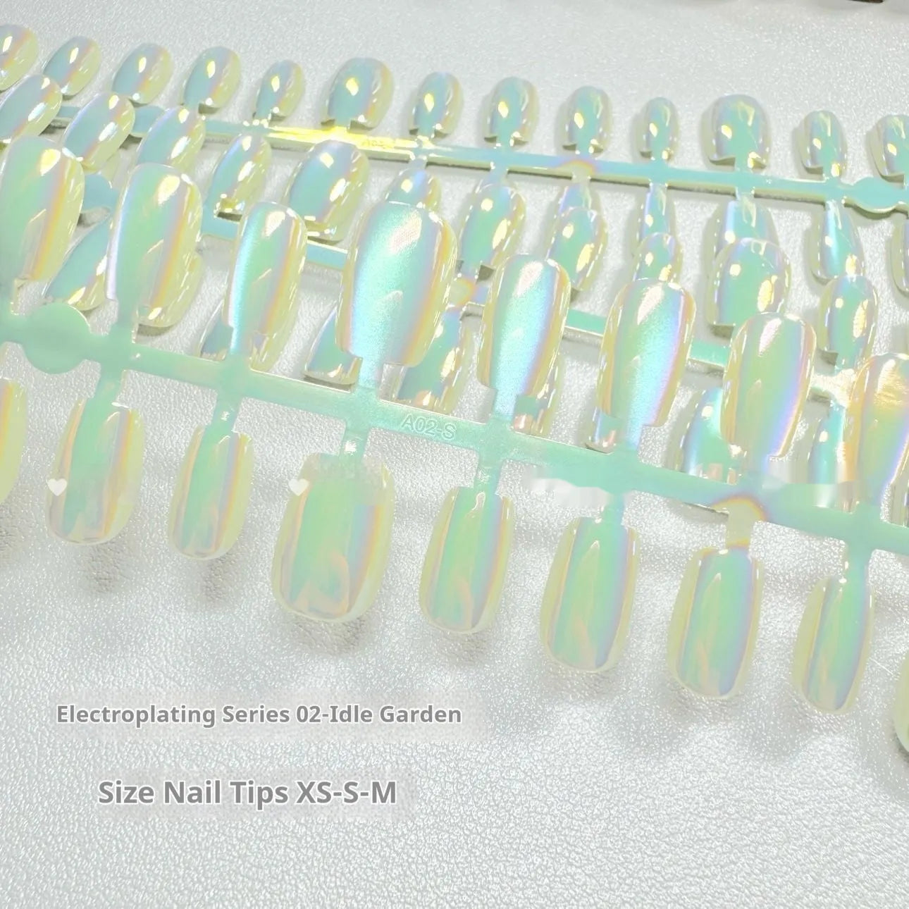 Electroplated Cat's Eye false nail set showing short ladder sizing in XS, S and M sizes with multiple finish options