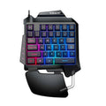 Black left-handed one-handed gaming keyboard with palm rest and shortcut keys on a desktop.