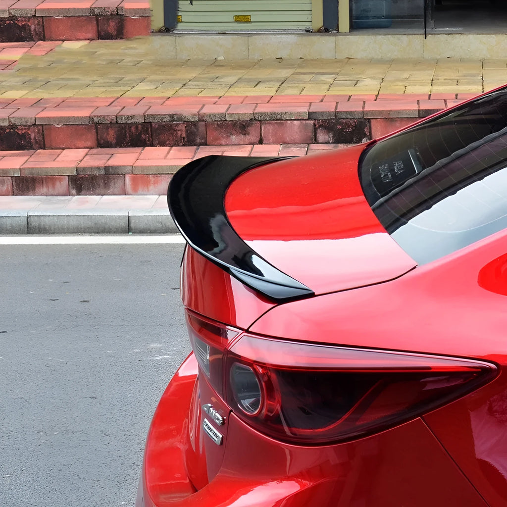 Mazda 3 Axela Exela large fixed sports blade tail trim in bright black or carbon grain finish for 2014-2021 RS models
