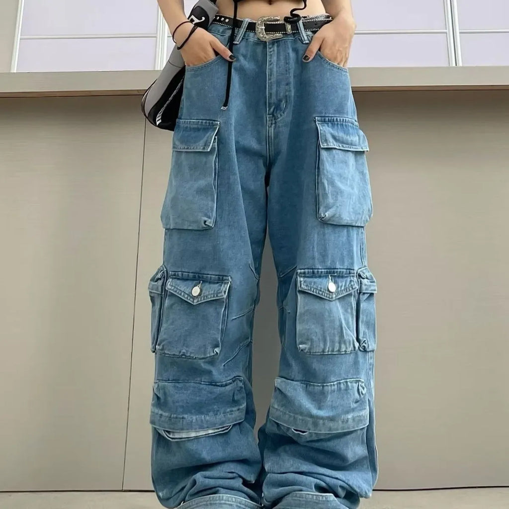 Women's blue high waist wide leg jeans with multiple pockets on a neutral background.
