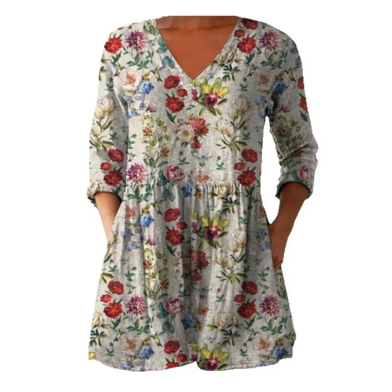 Women's loose-fitting printed dress with 3/4 sleeves and a wide waist design.