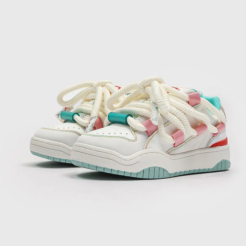 Low-top lace-up casual sneakers in denim blue with a round toe and thick rubber sole.