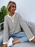 Black striped women's casual top with drop shoulders and button detail