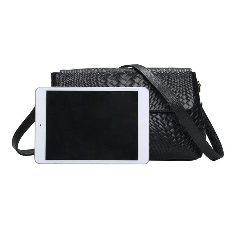 Black genuine leather woven crossbody bag with embossed finish, soft carry handle, and single shoulder strap.