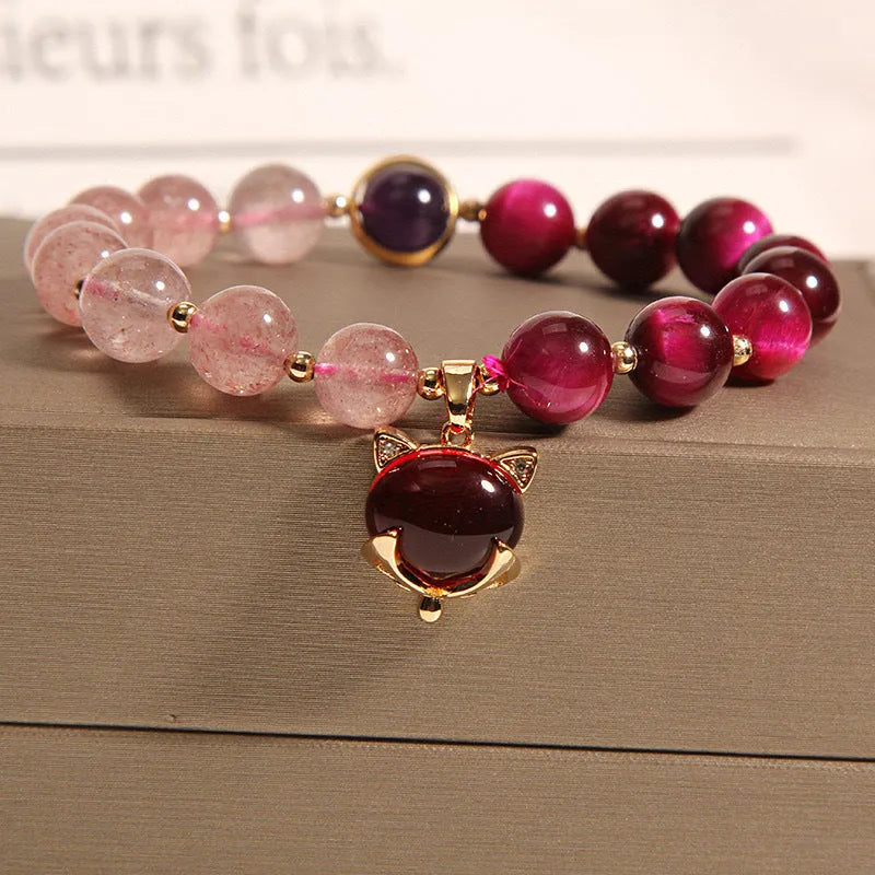Women's strawberry crystal bracelet with elastic rope showing uniform 18cm size and simple design