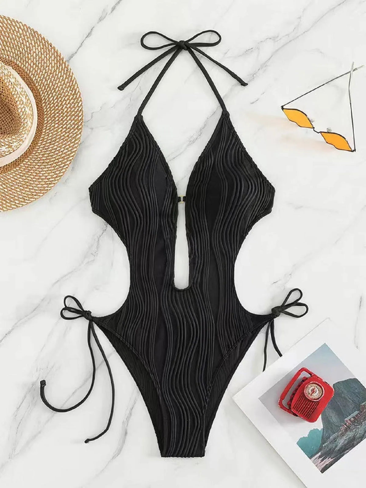 Women's black lace-up triangle bikini swimsuit with adjustable front on mannequin